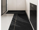 Black, long kitchen mat made of waterproof PVC.