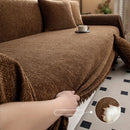 Minimalist chenille sofa towel in Herribone style with fringed border.