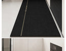 Black, long kitchen mat made of waterproof PVC.