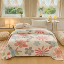 Multifunctional velvet blanket with snowflake print.