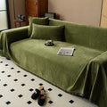 Minimalist chenille sofa towel in Herribone style with fringed border.