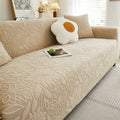 Elastic sofa cover with camellia jacquard print.