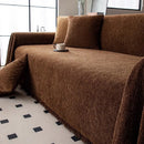 Minimalist chenille sofa towel in Herribone style with fringed border.