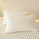 Thick, solid-colored faux rabbit fur mattress cover