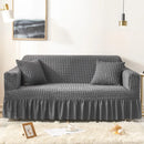 Sofa cover with a highly elastic bubble texture.