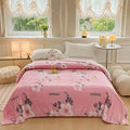 Multifunctional velvet blanket with snowflake print.