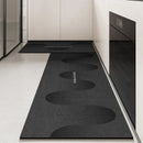 Black, long kitchen mat made of waterproof PVC.