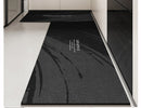 Black, long kitchen mat made of waterproof PVC.