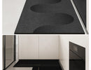 Black, long kitchen mat made of waterproof PVC.