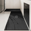Black, long kitchen mat made of waterproof PVC.