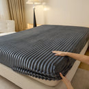 Thick, solid-colored faux rabbit fur mattress cover