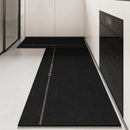 Black, long kitchen mat made of waterproof PVC.