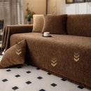 Minimalist chenille sofa towel in Herribone style with fringed border.